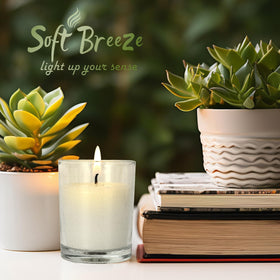 SOFT BREEZE ivory votive candle in glass decorates weddings and festive tables.