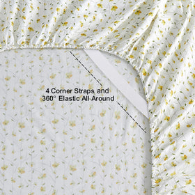 Softan yellow floral queen flat sheet spread across the bed for a crisp look.