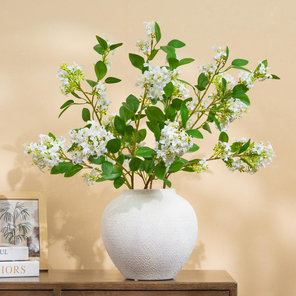 Somikis white daphne branch enhances vase decor with lifelike leaves and easy upkeep