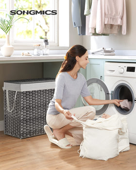 SONGMICS 130L hamper lid open gray demonstrates easy access for sorting delicates.