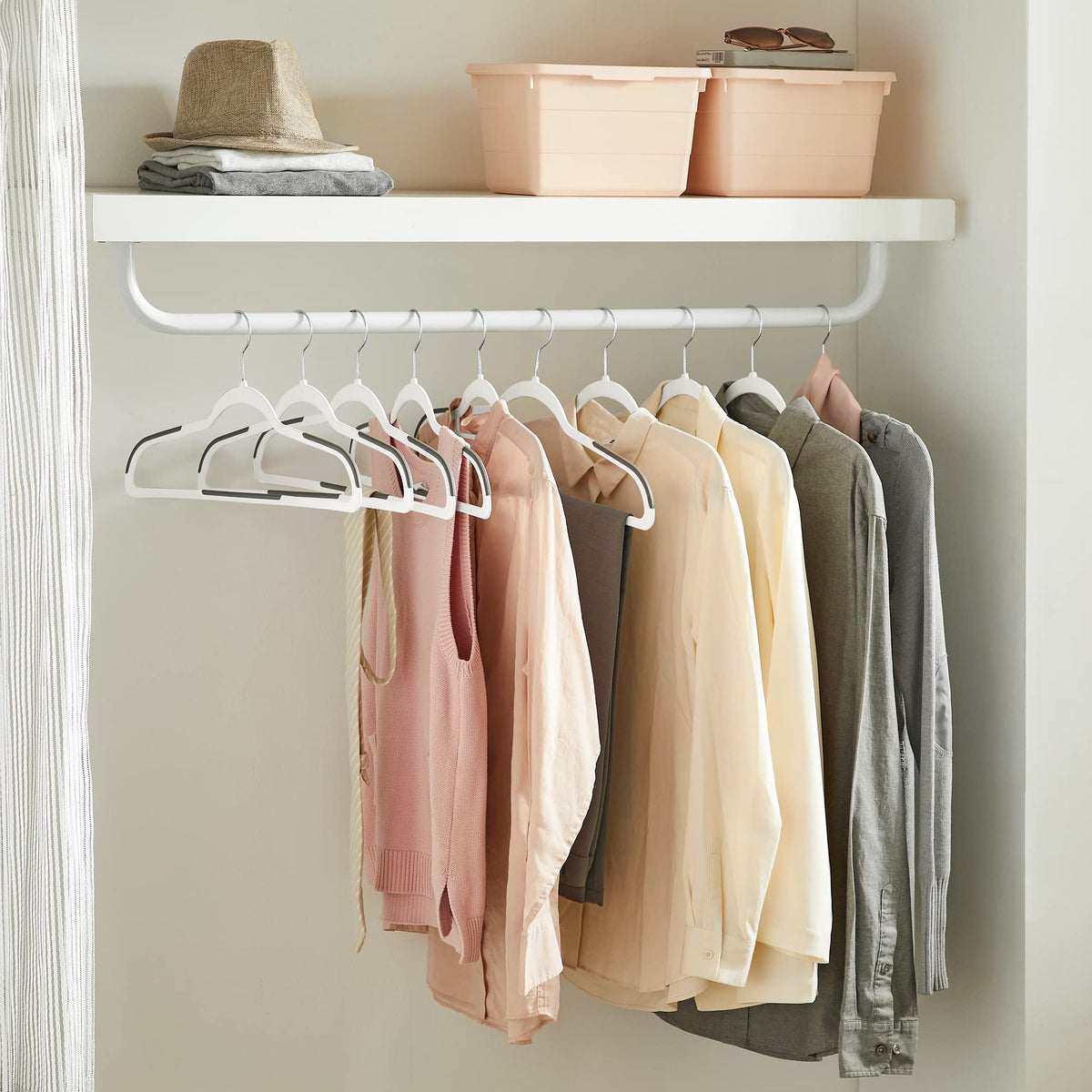 SONGMICS 360-degree hooks provide easy access to clothing.