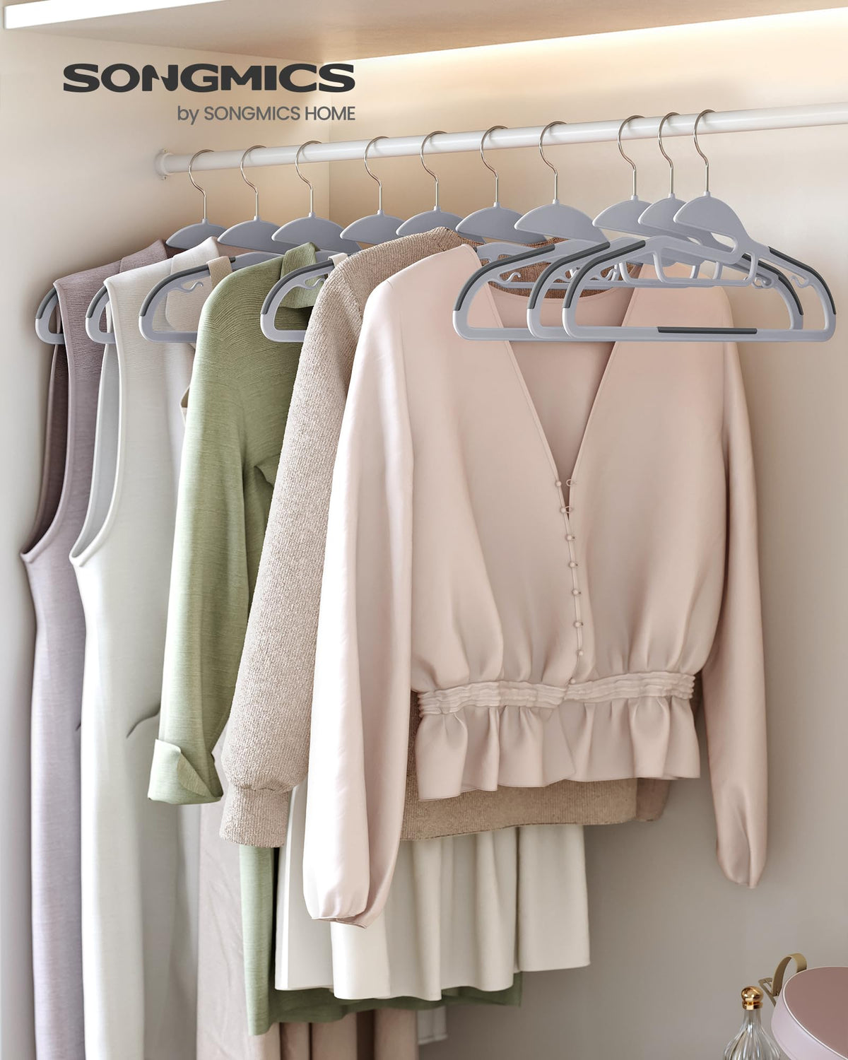 SONGMICS heavy-duty hangers support up to 11 lb, preserving heavy knits.