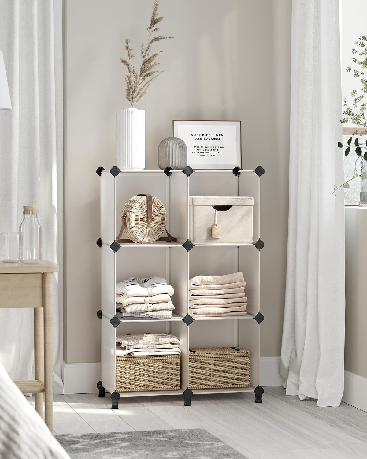 Songmics 6-cube storage raised feet keep items elevated and surfaces cleaner.