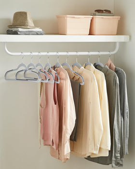 SONGMICS ABS plastic hanger close-up highlights durability and smooth shoulders