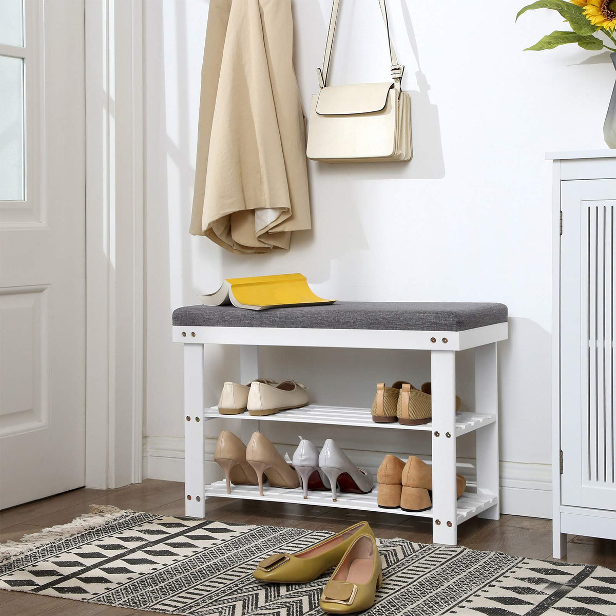 SONGMICS bamboo shoe bench with two shelves keeps shoes neatly organized.
