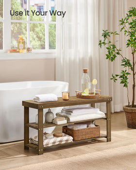SONGMICS bamboo shoe rack bench in entryway used as seating.