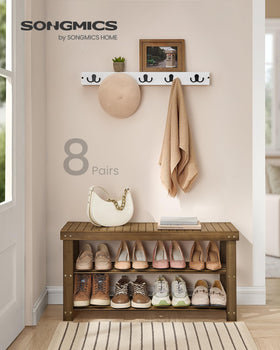 SONGMICS bamboo shoe rack bench shelves close-up showing sturdy top panel.