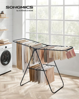 SONGMICS rack with height-adjustable wings adapts to different garment lengths.