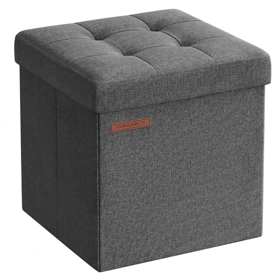 SONGMICS dark gray folding storage ottoman close-up shows tufted linen-look surface