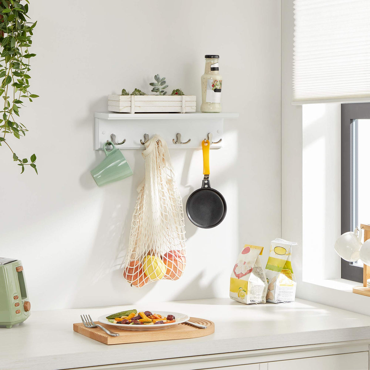 Songmics four-hook area close-up shows sturdy metal hooks for heavy items