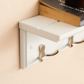 Songmics wall-mounted wooden shelf provides surface for keys and small items
