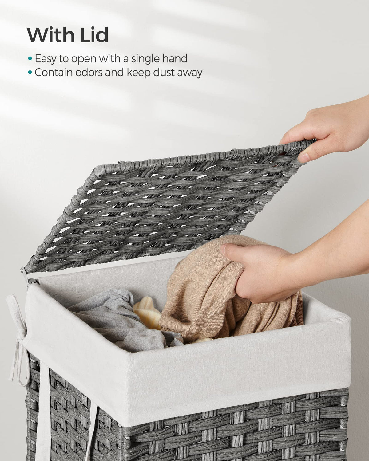 SONGMICS laundry hamper with side handles for effortless carrying.