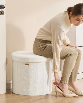 SONGMICS Mazie ottoman in a bedroom as a vanity stool option.