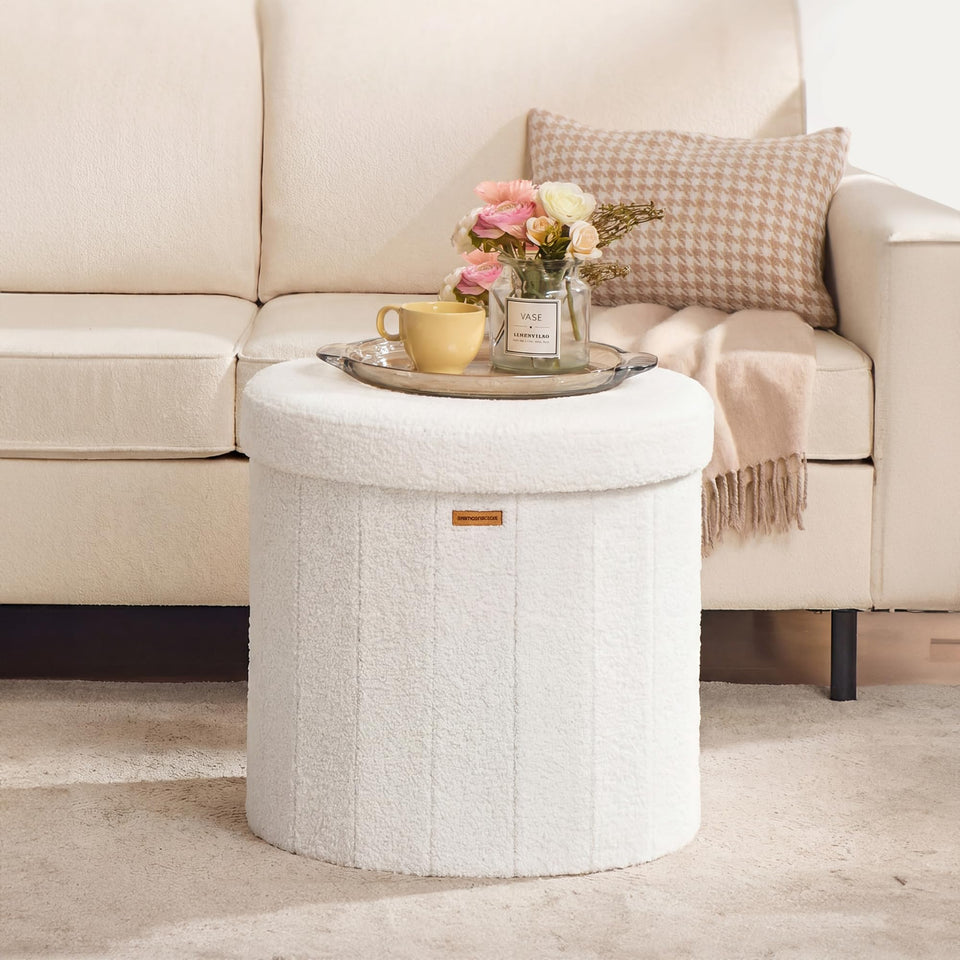SONGMICS Mazie ottoman folded flat for space-saving storage.