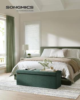 SONGMICS MAZIE ottoman with open interior highlights 131 L capacity for blankets and throws.