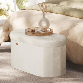 Songmics Mazie oval storage ottoman with lid open showcasing ample interior space.