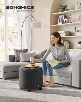 Songmics round ottoman with wood legs adds sturdy seating support.