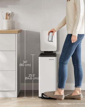 SONGMICS trash can placed between cabinets to maximize space
