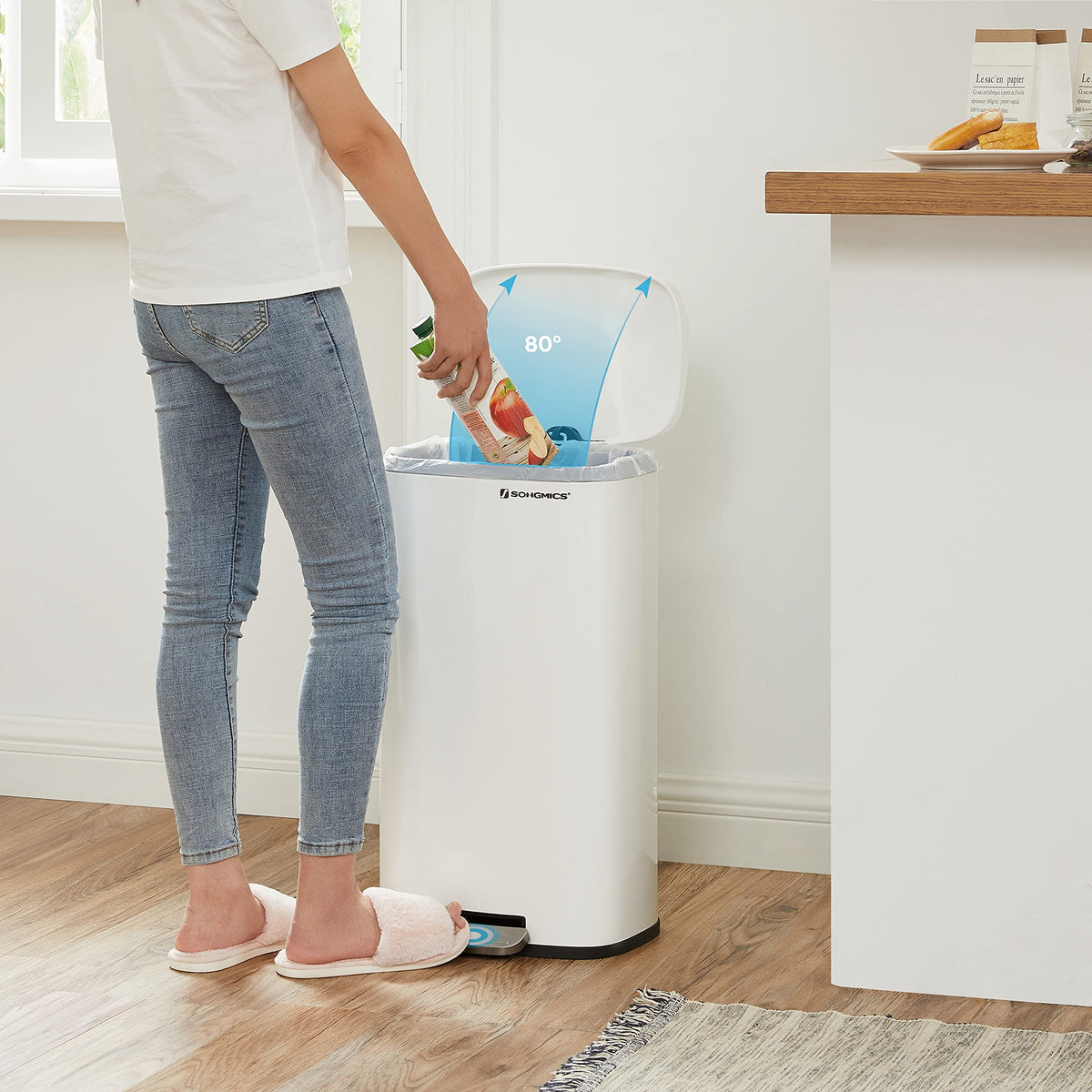Songmics trash can opens easily by hand or with pedal.