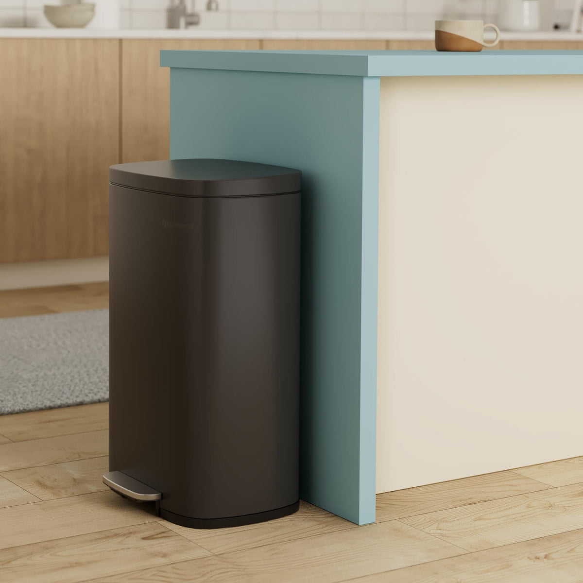 Songmics soft-close lid in action for quiet, mess-free kitchen waste disposal.