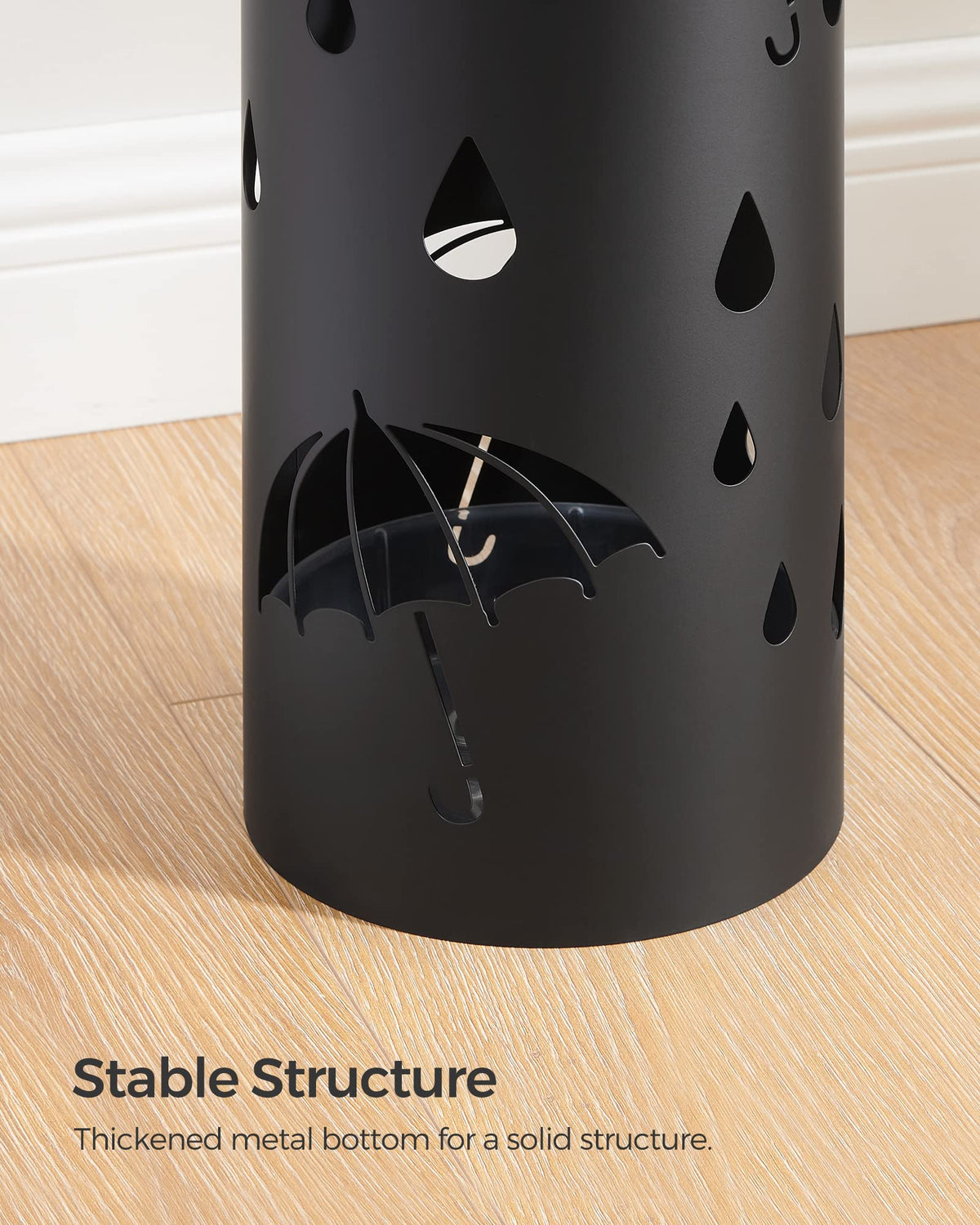SONGMICS umbrella stand doubles as a small organizer for canes or wraps.