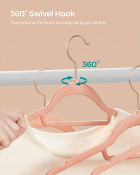 SONGMICS coral pink velvet hangers brighten closets while organizing garments.