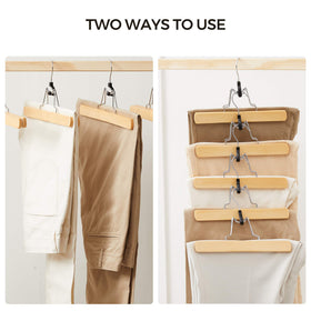 Songmics wooden pants hangers in a tidy closet setup.