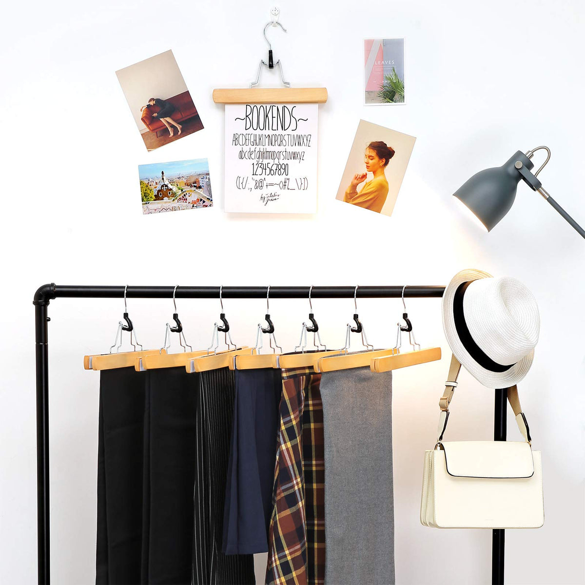 Songmics wooden pants hangers side profile with slim design.
