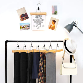 Songmics wooden pants hangers side profile with slim design.