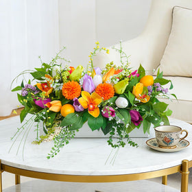 Soomeir dense floral centerpiece with tulips and dahlias adds depth to interiors
