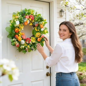 Soomeir green floral wreath with daisies enhances porch appeal