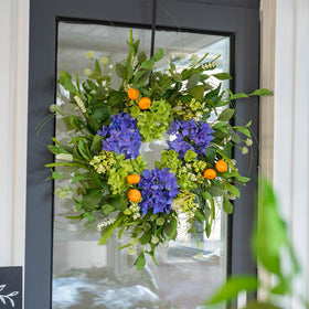 Soomeir mini mandarins accent rustic farmhouse wreath for warm entry.