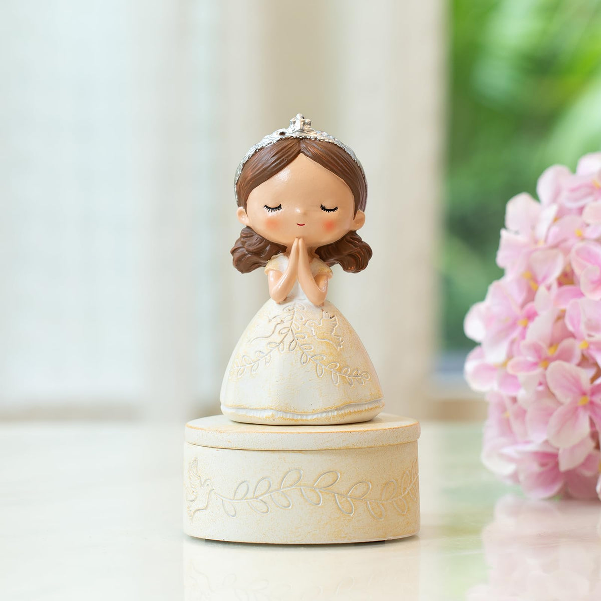 Dress detail showing doves and olive branches on the SOREFAFA figurine