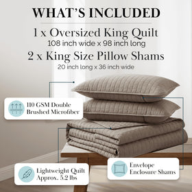 Southshore Fine Living king quilt with pillow shams in a tidy bedroom vignette.