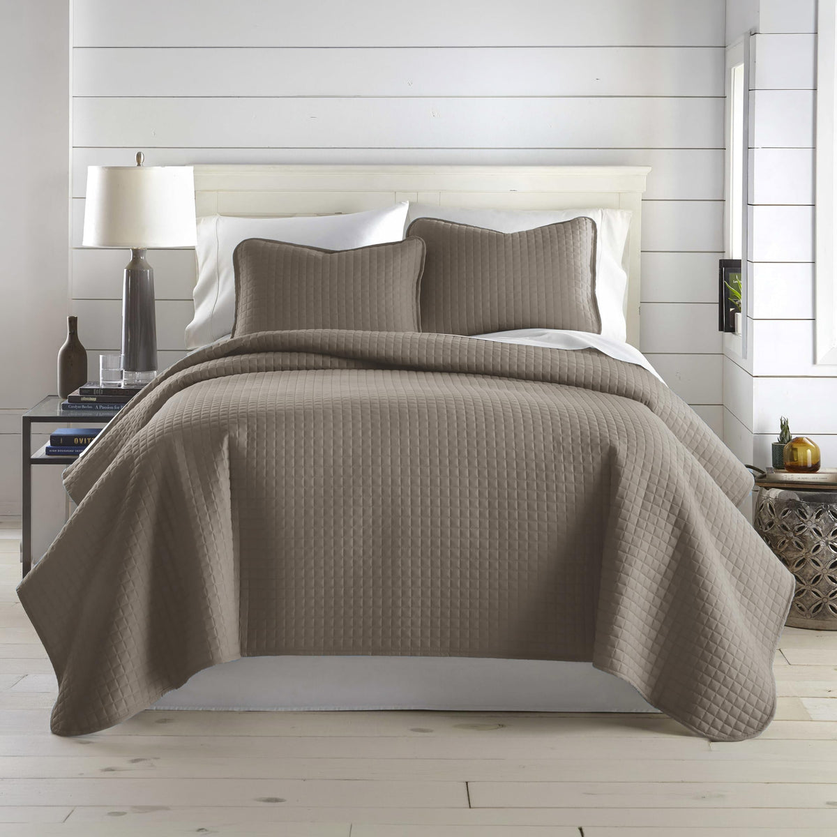 Southshore Fine Living oversized king quilt set draped on a bed for a clean, inviting look.