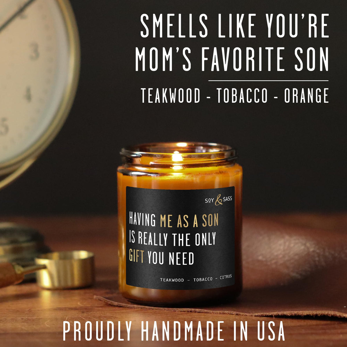 Cursive gold foil label on Soy and Sass candle
