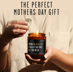 Hand-poured in the USA Soy and Sass candle on a wooden surface