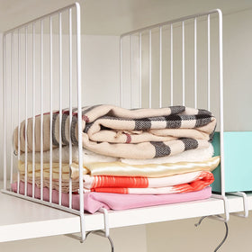 SSAWcasa shelf dividers on wood shelves for organized storage and clutter reduction.