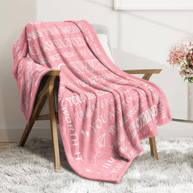 SteadStyle cozy blanket laid on the couch for relaxing recovery moments.