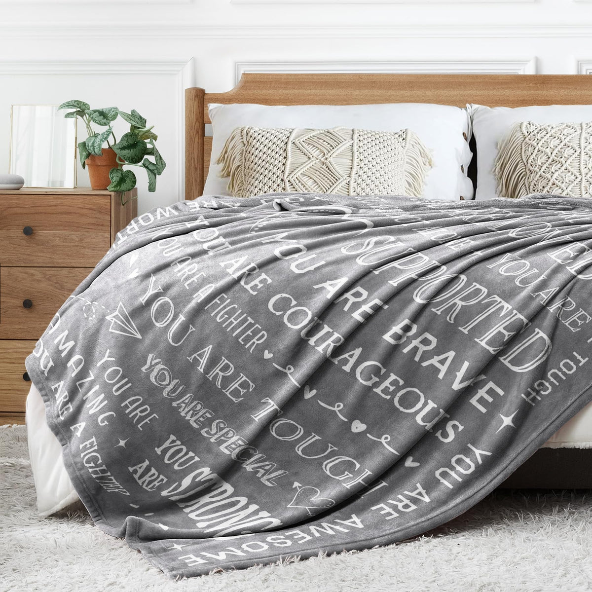 SteadStyle Get Well Soon Blanket on a bed for restful warmth.