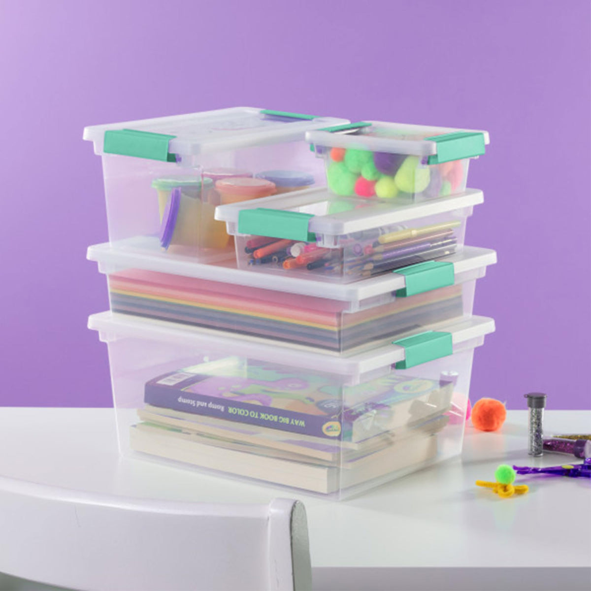 Sterilite clip box holds standard 8.5x11 papers and notebooks.