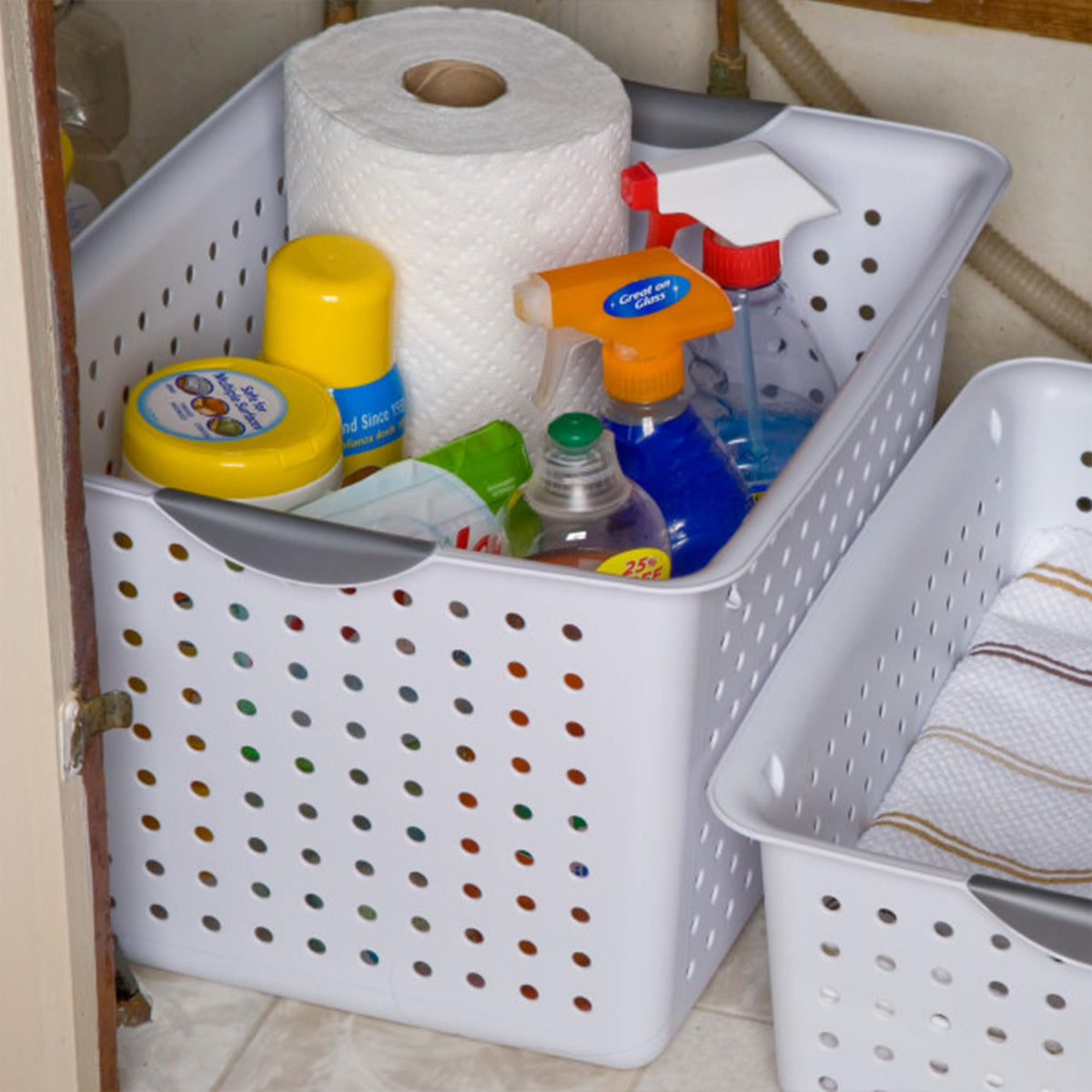 Sterilite laundry room basket for organizing detergents and linens.