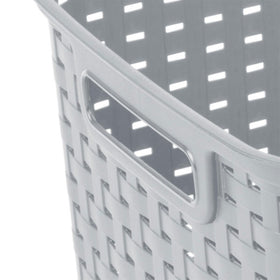 Sterilite weave basket in a bedroom closet for tidy wardrobe organization