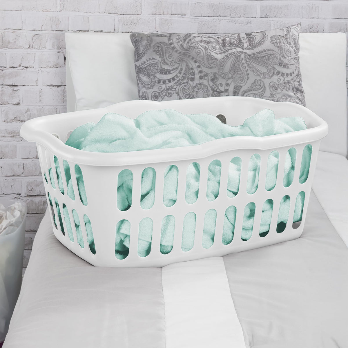 Sterilite white laundry basket adds a clean look to rooms.