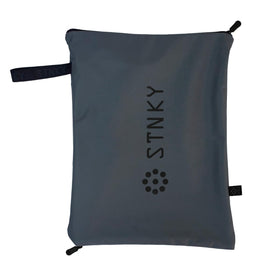 STNKY Bag Pro side handle shown for easy carrying between gym and car.