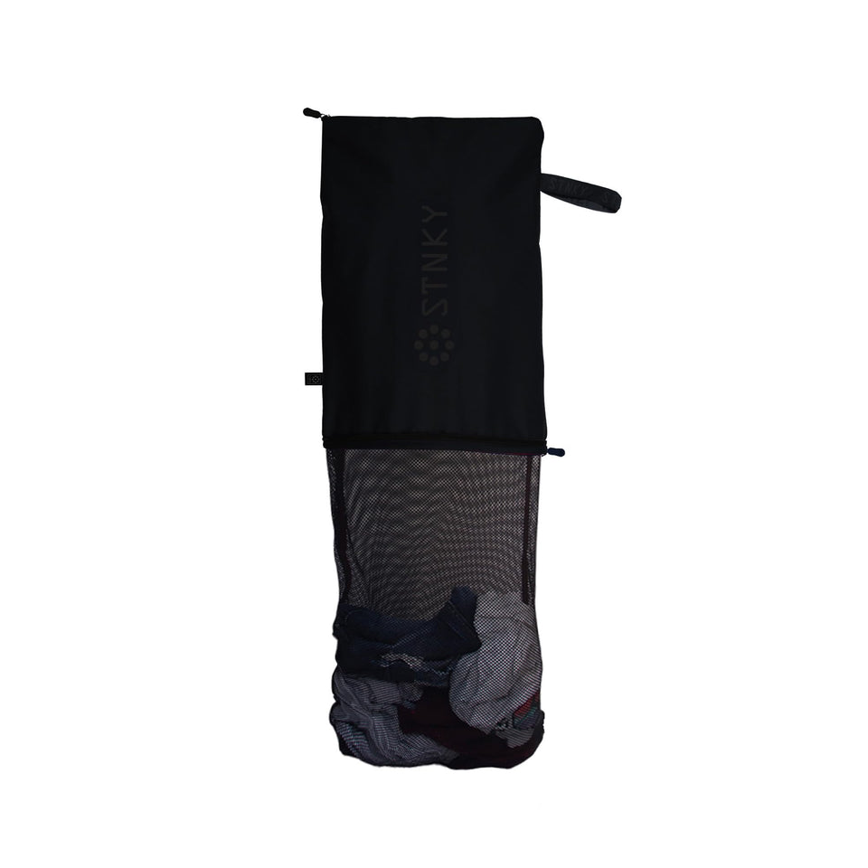STNKY Bag Pro with a zipper keeps dirty gear separate from clean clothes for easier laundry.