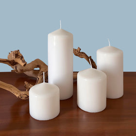 Mantel decoration featuring Stonebriar white pillar candles
