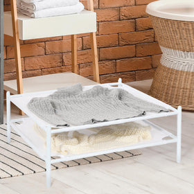 Storage Maniac two-pack stackable racks saving space between layers for laundry.