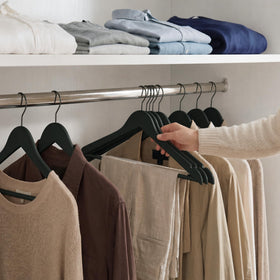 StorageWorks black coat and suit hangers in wood for formal garments.