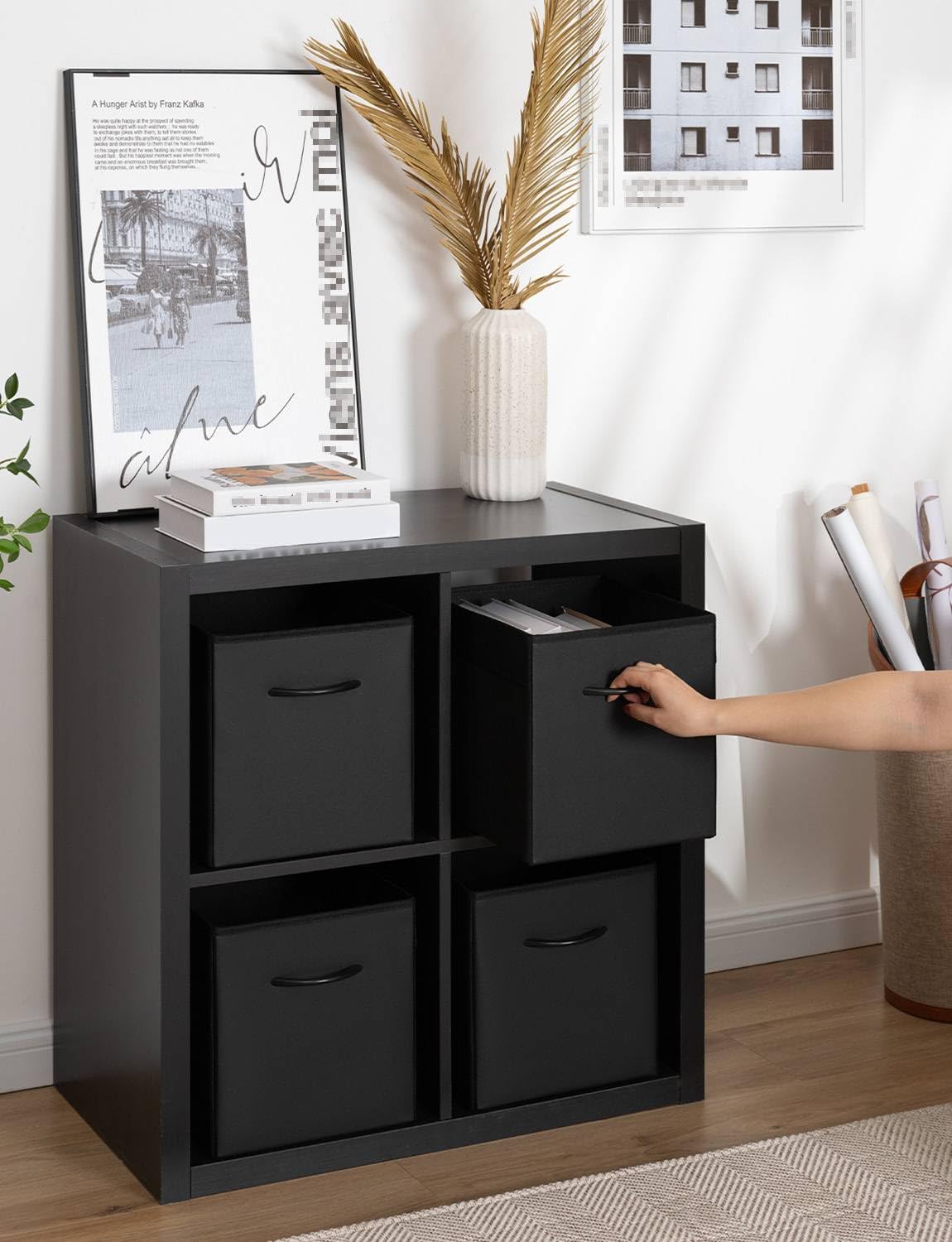 StorageWorks black cube bin featured in a bedroom setup for versatile storage.